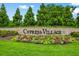 Beautiful monument sign with seasonal color that welcomes you to Cypress Village at 194 Zostera Dr., Little River, SC 29566