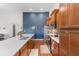 Well-equipped kitchen featuring a large island with a sink, ample counter space, and wood cabinets at 194 Zostera Dr., Little River, SC 29566