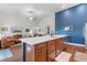 Bright open-concept kitchen and living room featuring an island and stainless steel appliances at 194 Zostera Dr., Little River, SC 29566