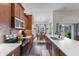 Well-appointed kitchen with stainless appliances, an island, and a view into the dining area at 194 Zostera Dr., Little River, SC 29566