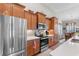 Modern kitchen featuring stainless steel appliances, wood cabinets, and eat-in breakfast area at 194 Zostera Dr., Little River, SC 29566