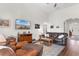 Spacious living room with vaulted ceiling and leather furniture, with views of other rooms in the home at 194 Zostera Dr., Little River, SC 29566