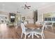 Bright and airy lounge area with cozy seating, a fireplace, and multiple ceiling fans at 194 Zostera Dr., Little River, SC 29566