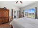 Large main bedroom features a door to the outside and a window with views of the backyard at 194 Zostera Dr., Little River, SC 29566