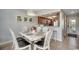 Charming dining area with neutral decor and kitchen bar at 201 N Hillside Dr. # 311-A, North Myrtle Beach, SC 29582