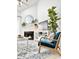 Cozy living room with a fireplace, a blue accent chair, and neutral decor at 201 N Hillside Dr. # 311-A, North Myrtle Beach, SC 29582