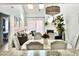 Open floor plan featuring a sunlit dining and living area at 201 N Hillside Dr. # 311-A, North Myrtle Beach, SC 29582