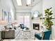 This charming living room features a fireplace, high ceilings, and natural light at 201 N Hillside Dr. # 311-A, North Myrtle Beach, SC 29582