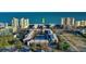 Aerial view of a beachfront property with pool and tennis court at 208 N Ocean Blvd. # 321, North Myrtle Beach, SC 29582