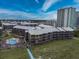 Aerial view showcases a beachside condo and blue beach access path near the ocean at 208 N Ocean Blvd. # 321, North Myrtle Beach, SC 29582