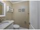Stylish powder room with modern fixtures, a vanity with a marble countertop, and decorative wall art at 208 N Ocean Blvd. # 321, North Myrtle Beach, SC 29582