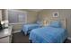 Cozy bedroom furnished with twin beds and a dresser at 208 N Ocean Blvd. # 321, North Myrtle Beach, SC 29582