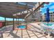 Inviting hot tub under a pergola, near community pool with patio furniture at 208 N Ocean Blvd. # 321, North Myrtle Beach, SC 29582