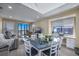 Open-concept living and dining area with large windows and access to a private balcony at 208 N Ocean Blvd. # 321, North Myrtle Beach, SC 29582