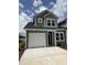 Charming two-story home features an attached garage, tidy landscaping, and vinyl siding at 2080 Victory Way # 568, Myrtle Beach, SC 29579