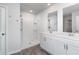 Modern bathroom featuring double sink vanity, framed mirrors, and a spacious walk-in shower at 211 Seasons Trace Loop, Longs, SC 29568