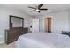 Bedroom featuring a large dresser, plush carpeting and a ceiling fan, offering ample storage and comfort at 211 Seasons Trace Loop, Longs, SC 29568