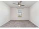 Bedroom with carpet, ceiling fan, and large window, flooding the space with natural light at 211 Seasons Trace Loop, Longs, SC 29568