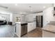Stylish kitchen island with stainless steel dishwasher, granite countertops and modern cabinets, perfect for entertaining at 211 Seasons Trace Loop, Longs, SC 29568