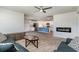 Bright open floor plan featuring a cozy living room and direct views into the kitchen with granite countertops at 211 Seasons Trace Loop, Longs, SC 29568