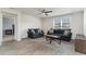 Comfortable living room with large window, ceiling fan, wood-look flooring and two comfortable sofas at 211 Seasons Trace Loop, Longs, SC 29568