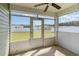Screened-in porch with ceiling fan and view of backyard at 211 Seasons Trace Loop, Longs, SC 29568