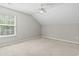 Carpeted bedroom features a ceiling fan and natural light at 215 Carolina Farms Blvd., Myrtle Beach, SC 29579