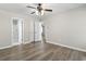 Bedroom with wood floors, ceiling fan, and ensuite bathroom at 215 Carolina Farms Blvd., Myrtle Beach, SC 29579
