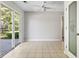 Bright dining room with tile flooring, pantry, fan, and sliding glass door to back patio at 215 Carolina Farms Blvd., Myrtle Beach, SC 29579