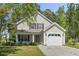 Charming two-story home with a one car garage and a beautifully landscaped front yard at 215 Carolina Farms Blvd., Myrtle Beach, SC 29579