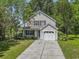 Charming two-story home with a one car garage and a beautifully landscaped front yard at 215 Carolina Farms Blvd., Myrtle Beach, SC 29579