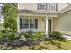 Close-up of front porch and garden with a classic design and well-maintained landscaping at 215 Carolina Farms Blvd., Myrtle Beach, SC 29579