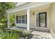 Close-up of front porch and garden with a classic design with updated front door, sidelight, and transom at 215 Carolina Farms Blvd., Myrtle Beach, SC 29579
