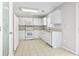 White kitchen with white appliances and tile floors at 215 Carolina Farms Blvd., Myrtle Beach, SC 29579