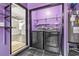 Washer and dryer hookups with wire rack shelving in the laundry room at 215 Carolina Farms Blvd., Myrtle Beach, SC 29579
