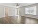 Living room with door to bathroom, wood floors, and bright natural light at 215 Carolina Farms Blvd., Myrtle Beach, SC 29579