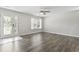 Bright living room with hardwood floors, ceiling fan and white trim at 215 Carolina Farms Blvd., Myrtle Beach, SC 29579