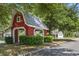 Playhouse near a home with a tree canopy and landscaping adds to the neighborhood's appeal and charm at 215 Carolina Farms Blvd., Myrtle Beach, SC 29579