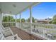 View from the balcony, featuring palm trees and neighboring houses with a clear sky backdrop at 215-B S Dogwood Dr., Surfside Beach, SC 29575