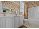 Bathroom with double sinks and a shower tub combo at 215-B S Dogwood Dr., Surfside Beach, SC 29575
