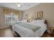 Bright bedroom features two twin beds, floral decor, and a sunny window at 215-B S Dogwood Dr., Surfside Beach, SC 29575
