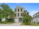 Charming three-story home with a private drive and lush tropical landscaping at 215-B S Dogwood Dr., Surfside Beach, SC 29575