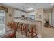 Bright kitchen with stainless steel appliances, bar seating, and ample counter space at 215-B S Dogwood Dr., Surfside Beach, SC 29575