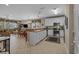 Open-concept kitchen with white cabinets, stainless appliances, and dining area at 215-B S Dogwood Dr., Surfside Beach, SC 29575