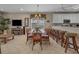 Open living space with a dining table, bar seating, and entertainment center at 215-B S Dogwood Dr., Surfside Beach, SC 29575