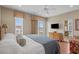 Bedroom featuring a king bed, balcony access, dresser, and an en-suite bathroom entrance at 215-B S Dogwood Dr., Surfside Beach, SC 29575