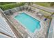 Aerial view of a private pool surrounded by a brick patio and white picket fence at 215-B S Dogwood Dr., Surfside Beach, SC 29575