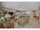 Inviting open-concept living room and kitchen area with tile floors and a ceiling fan at 215-B S Dogwood Dr., Surfside Beach, SC 29575