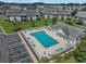Aerial view of the community features the pool area, landscaping, parking, and condo buildings from above at 217 Wando River Rd. # 12-H, Myrtle Beach, SC 29579