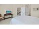 Bedroom with a tv and doorway views to living room and ensuite bathroom at 217 Wando River Rd. # 12-H, Myrtle Beach, SC 29579